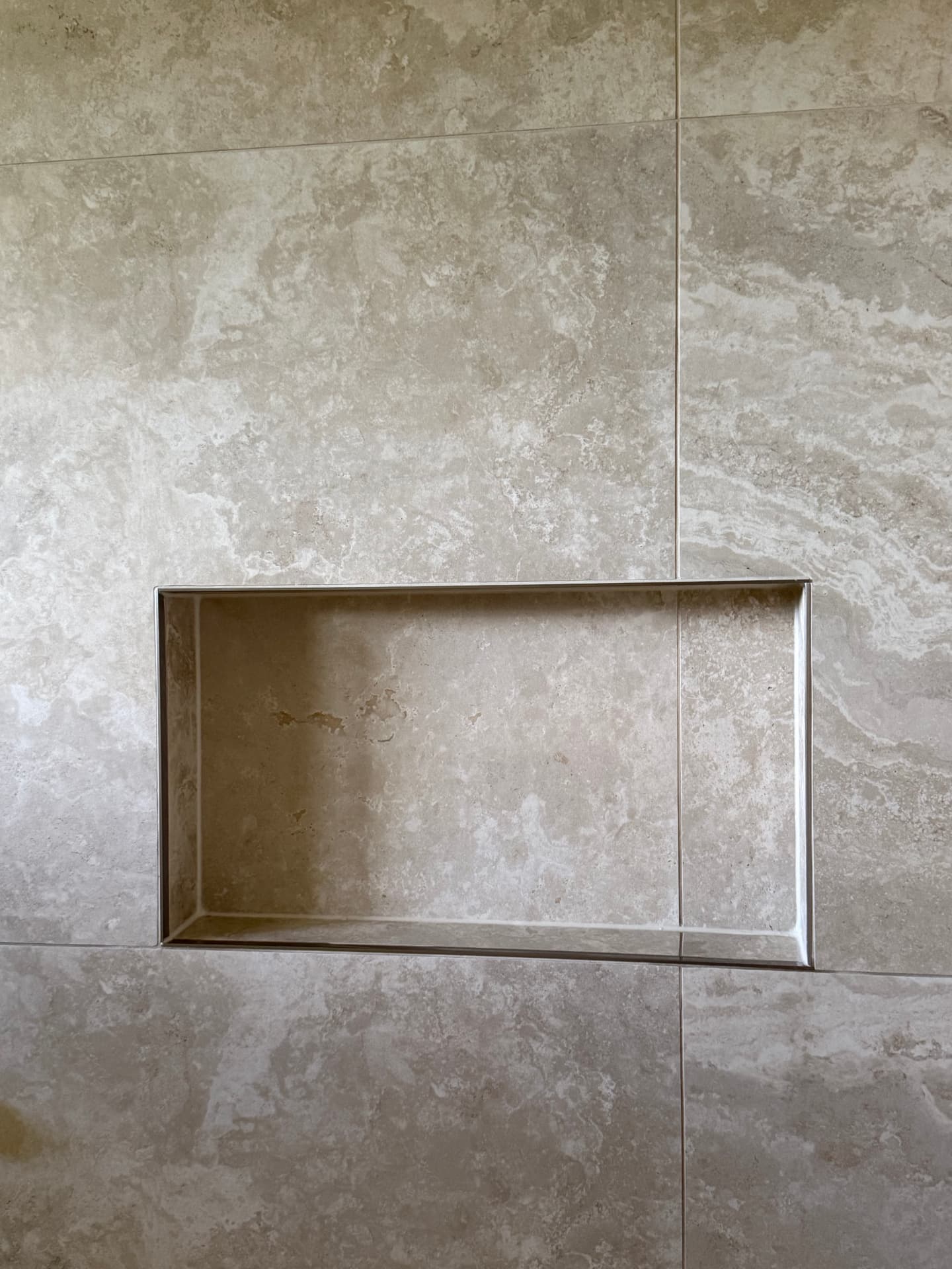 Shower niche finished with a slim metal trim